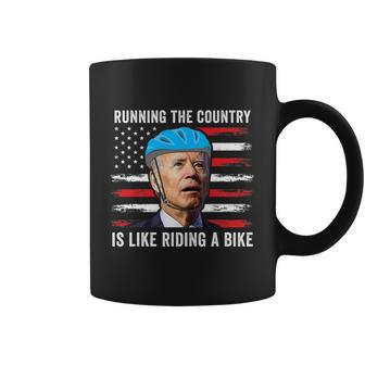 Joe Biden Falling Off His Bicycle Funny Biden Falls Off Bike America Flag Coffee Mug - Monsterry DE