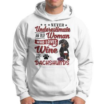 Never Underestimate An Old Woman Who Loves Wine And Dachshunds Men Hoodie - Thegiftio UK