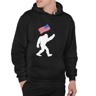 Bigfoot With American Flag Funny 4Th Of July Meaningful Gift Hoodie - Monsterry CA