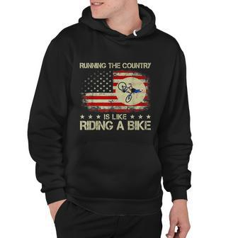 Funny Biden Falls Off Bike Running The Country Like Riding A Bike Hoodie - Thegiftio