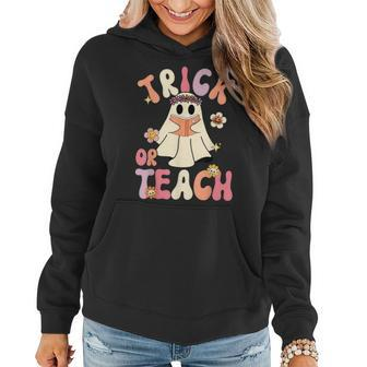 Groovy Halloween Trick Or Teach Retro Floral Ghost Teacher Women Hoodie - Thegiftio UK