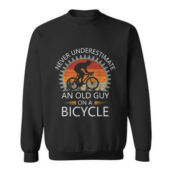 An Old Guy On A Bicycle Cycling Vintage Never Underestimate Sweatshirt - Thegiftio UK