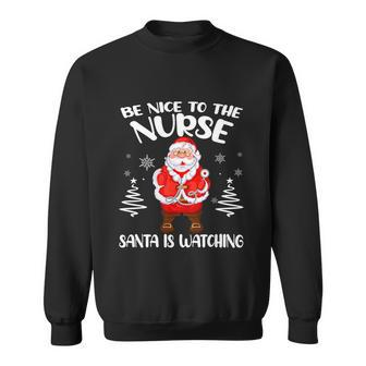 Be Nice To The Nurse Santa Is Watching Nursing Christmas Sweatshirt - Monsterry AU