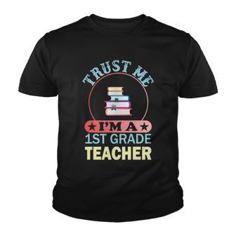 Trust Me Im A 1St Grade Teacher Funny School Graphics Plus Size Shirt Youth T-shirt - Monsterry AU
