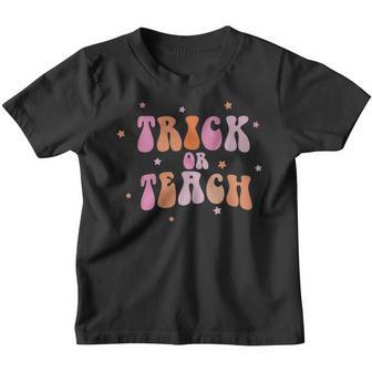 Vintage Groovy Trick Or Teach Halloween Teacher Life Retro Youth T-shirt - Thegiftio UK