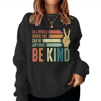 In A World Where You Can Be Anything Be Kind Women Crewneck Graphic Sweatshirt - Thegiftio UK