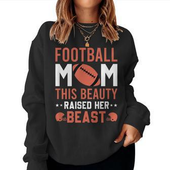 The Beauty Raised Her Beast Funny Football Saying For Mom Women Crewneck Graphic Sweatshirt - Thegiftio UK