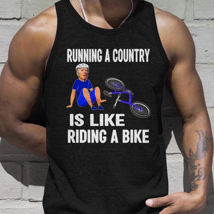 Biden Falls Off Bike Joe Biden Falling Off His Bicycle Funny Meme Unisex Tank Top Gifts for Him