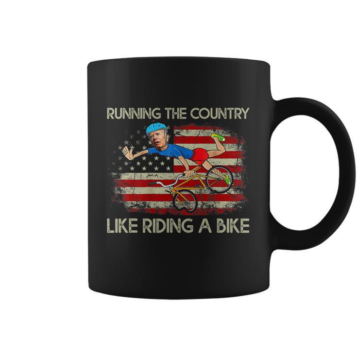 Biden Falls Off Bike Joe Biden Falling Off His Bicycle America Flag Coffee Mug