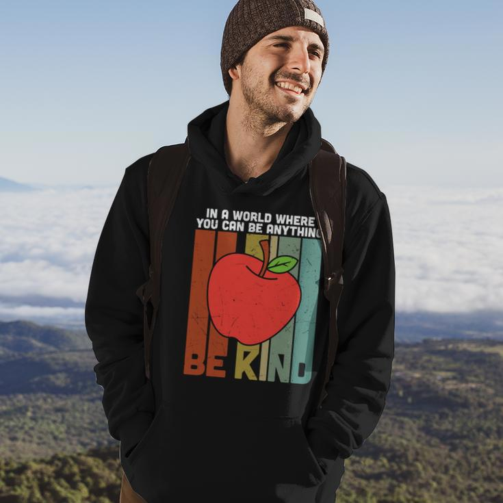 In A World Be Kind Teacher Apple Graphic Plus Size Shirt For Teacher Male Female Hoodie Lifestyle