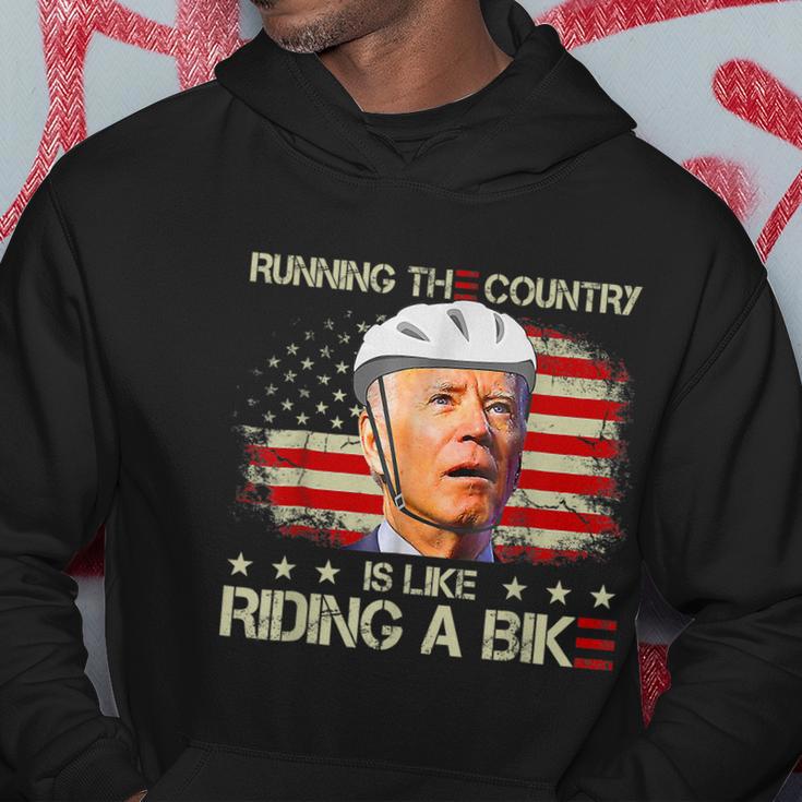 Joe Biden Falling Off Bike Running The Country Is Like Riding A Bike V2 Hoodie Unique Gifts