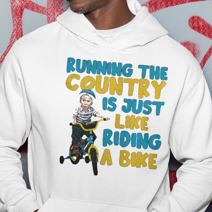 Joe Biden Running The Country Is Like Riding A Bike Hoodie Unique Gifts