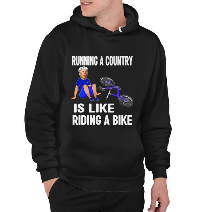 Biden Falls Off Bike Joe Biden Falling Off His Bicycle Funny Biden Hoodie