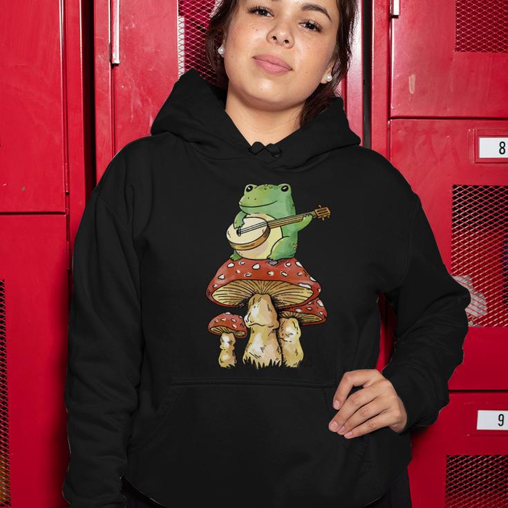 Frog Playing Banjo On Mushroom Cute Cottagecore Aesthetic Women Hoodie Unique Gifts