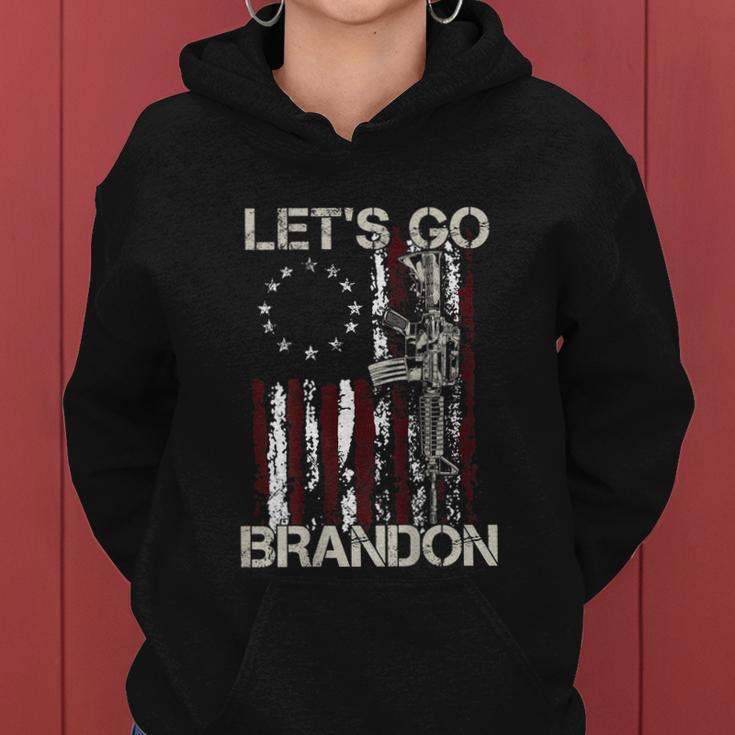 Gun American Flag Patriots Lets Go Brandon On Back Women Hoodie
