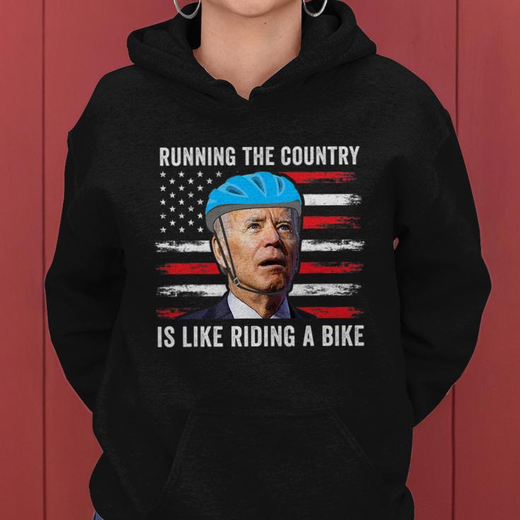 Joe Biden Falling Off His Bicycle Funny Biden Falls Off Bike America Flag Women Hoodie