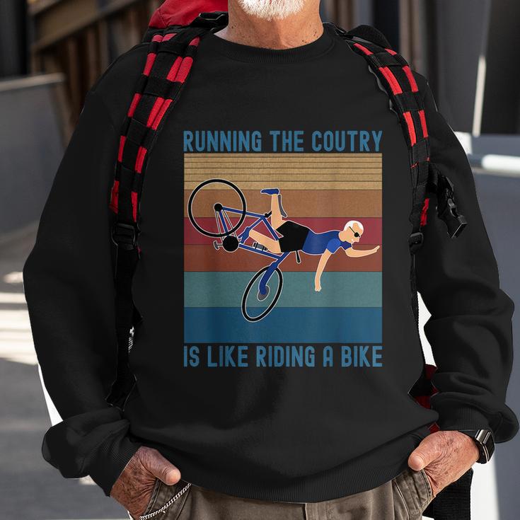 Funny Biden Falls Off Bike Running The Country Like Riding A Bike V3 Sweatshirt Gifts for Old Men