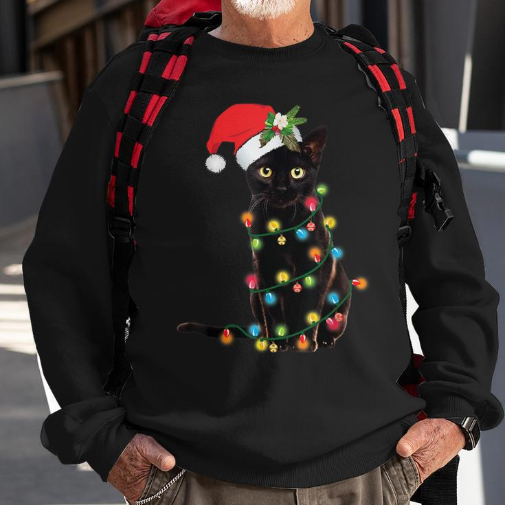 Santa Black Cat Tangled Up In Christmas Tree Lights Holiday Sweatshirt Gifts for Old Men