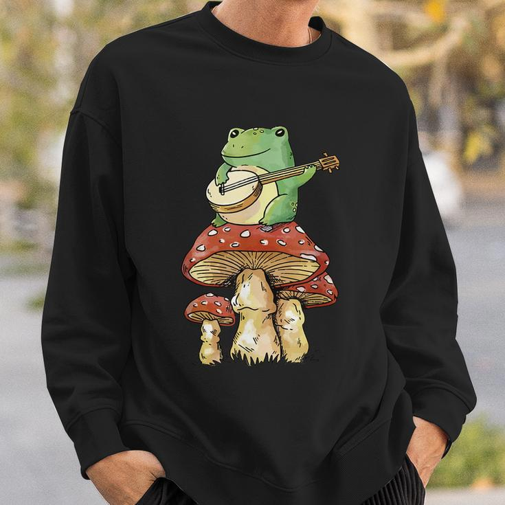 Frog Playing Banjo On Mushroom Cute Cottagecore Aesthetic Sweatshirt Gifts for Him