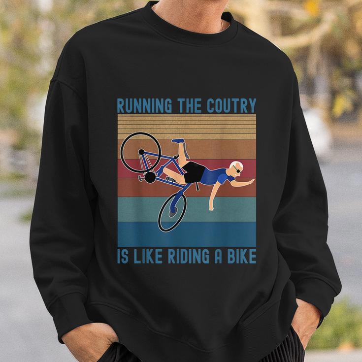 Funny Biden Falls Off Bike Running The Country Like Riding A Bike V3 Sweatshirt Gifts for Him