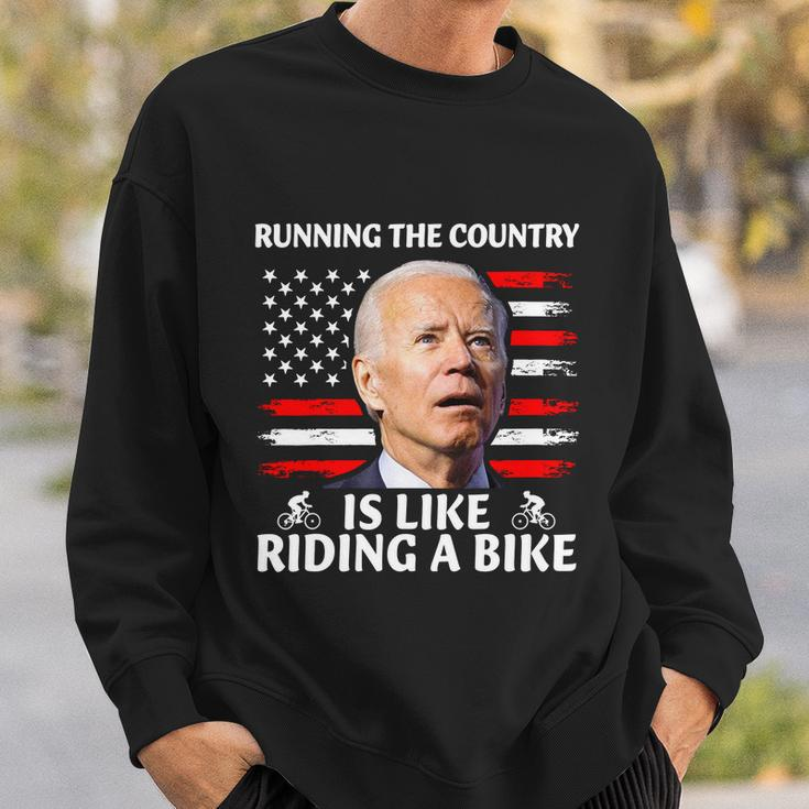 Joe Biden Falling Off Bike Running The Country Is Like Riding A Bike V3 Sweatshirt Gifts for Him