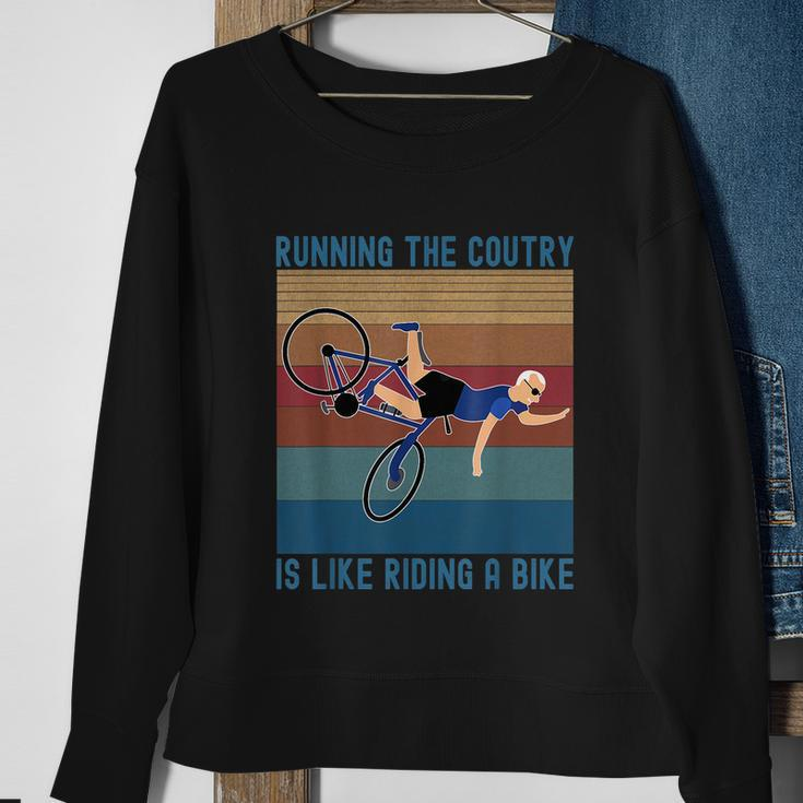 Funny Biden Falls Off Bike Running The Country Like Riding A Bike V3 Sweatshirt Gifts for Old Women