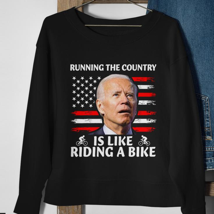 Joe Biden Falling Off Bike Running The Country Is Like Riding A Bike V3 Sweatshirt Gifts for Old Women