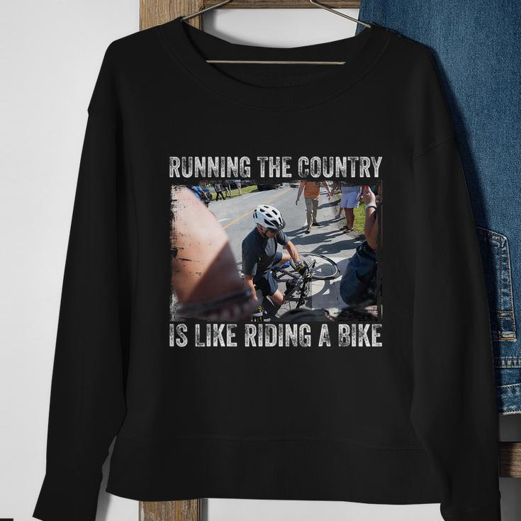 Running The Country Is Like Riding A Bike Joe Biden Funny Design Anti Biden Sweatshirt Gifts for Old Women
