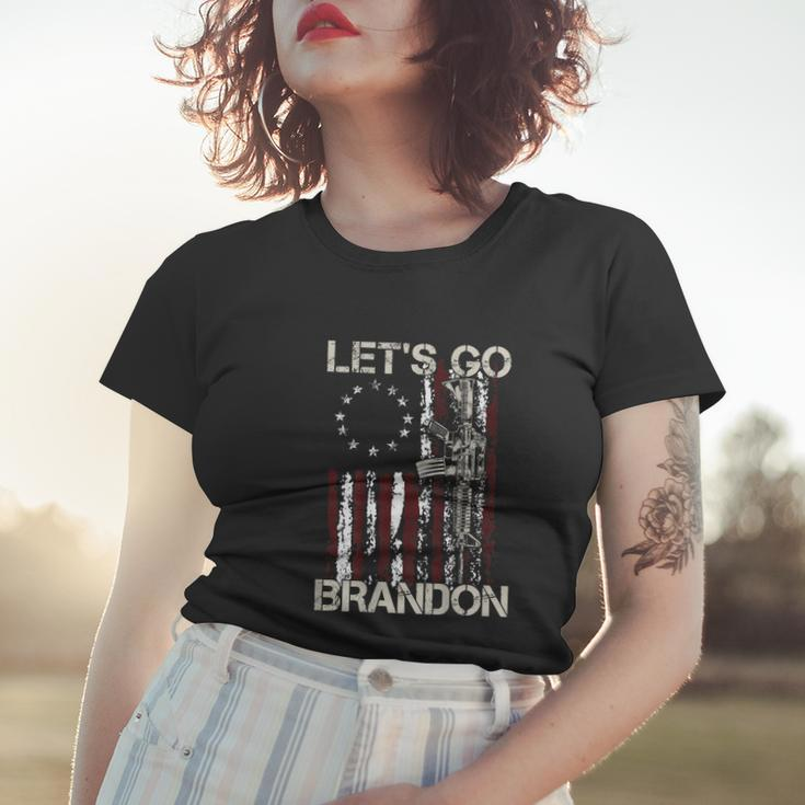 Gun American Flag Patriots Lets Go Brandon On Back Women T-shirt Gifts for Her