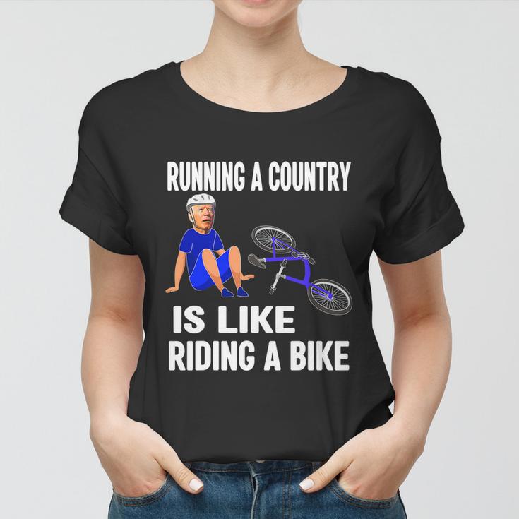 Biden Falls Off Bike Joe Biden Falling Off His Bicycle Funny Biden Women T-shirt