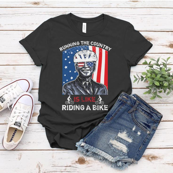 Joe Biden Falling Off His Bicycle Funny Biden Falls Off Bike V7 Women T-shirt Unique Gifts