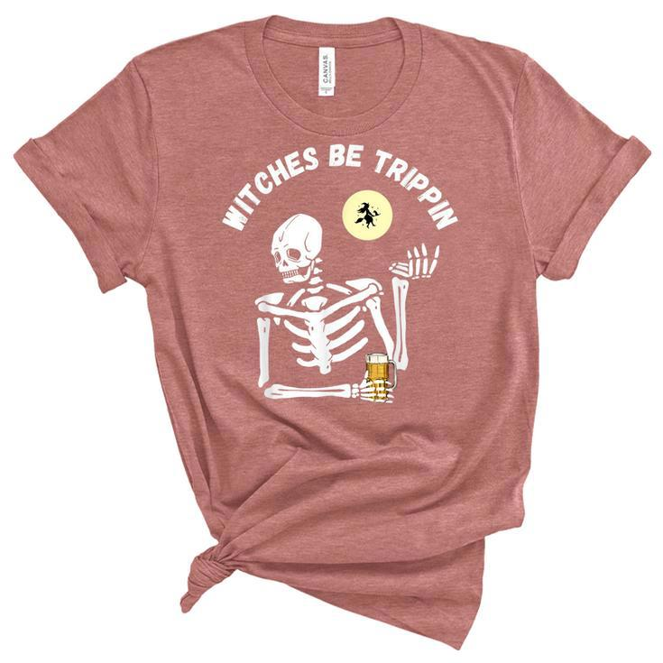 Witches Be Trippin Funny Halloween Skeleton And Witch Pun  Unisex Crewneck Soft Tee