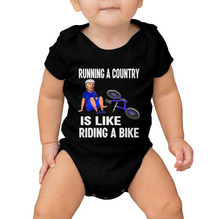 Biden Falls Off Bike Joe Biden Falling Off His Bicycle Funny Meme Baby Onesie