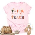 Trick Or Teach Cute Halloween Costume School Teacher Unisex Crewneck Soft Tee Light Pink