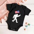 Bigfoot With American Flag Funny 4Th Of July Meaningful Gift Baby Onesie